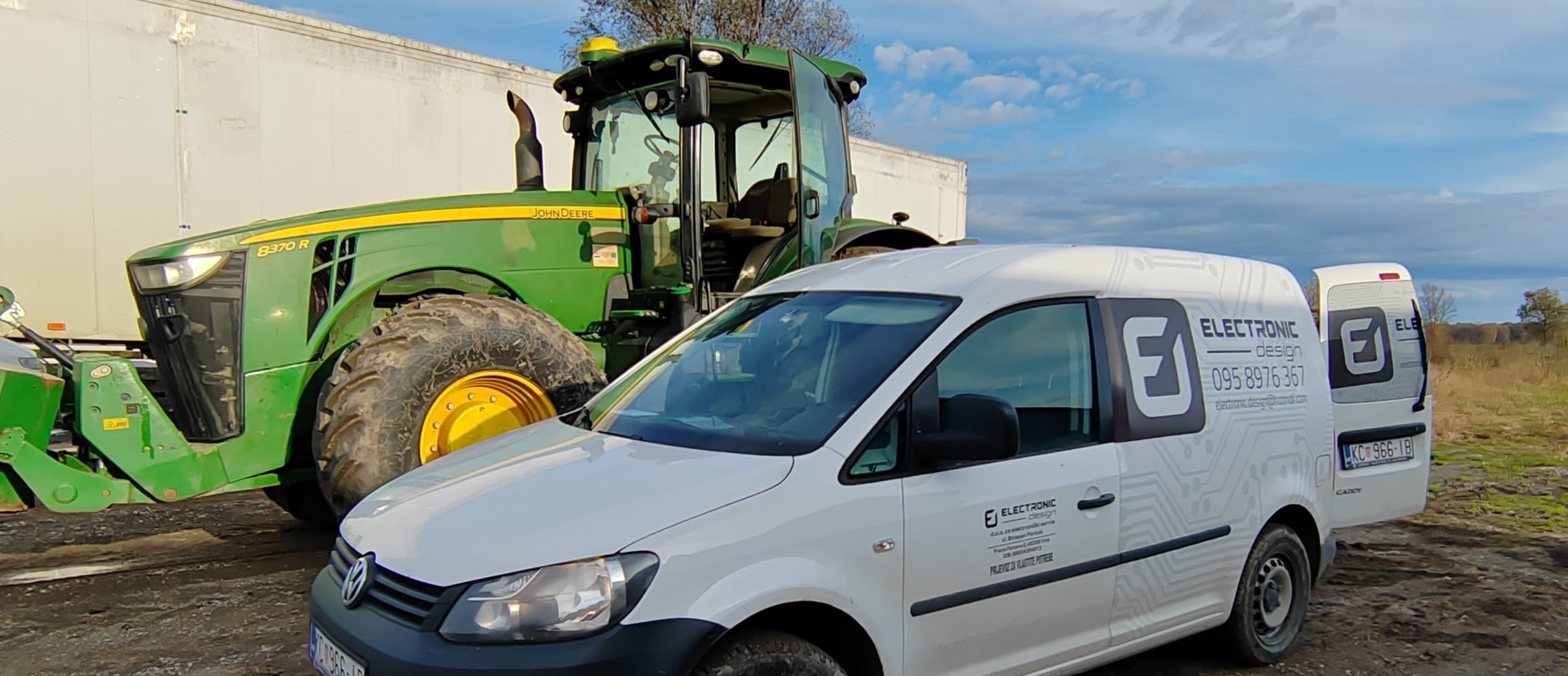 Tractor and service van in field