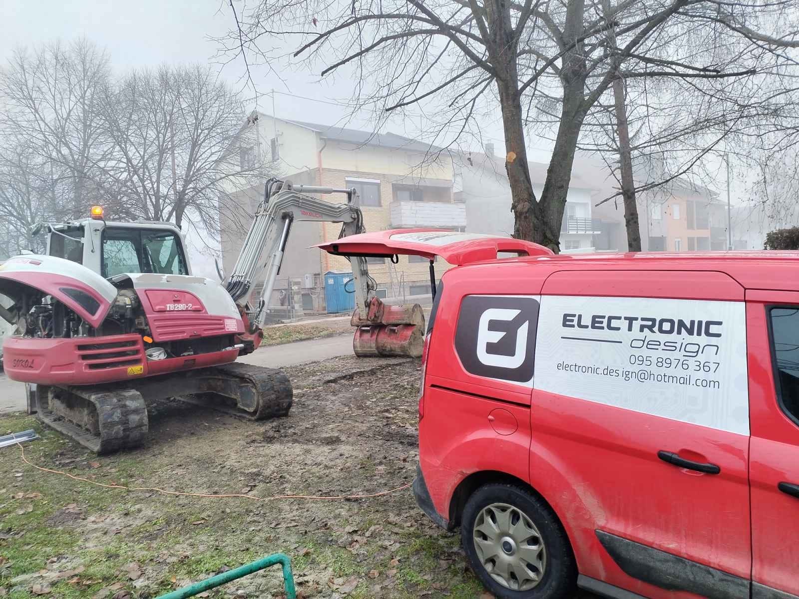 Construction site with machinery and van